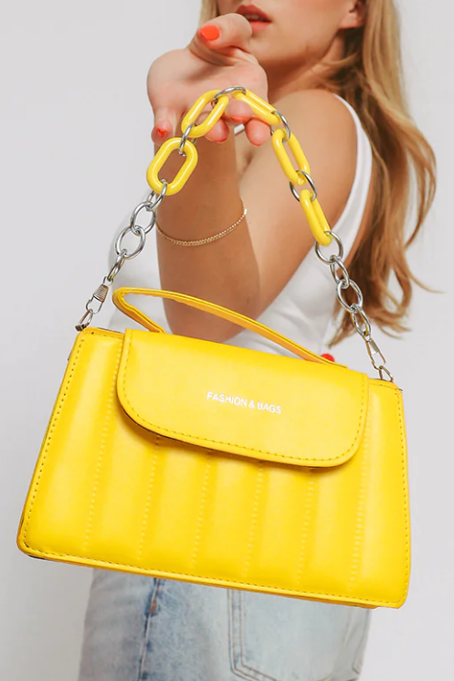Small yellow bag ART2254 made of high-quality faux leather with a decorative chain.