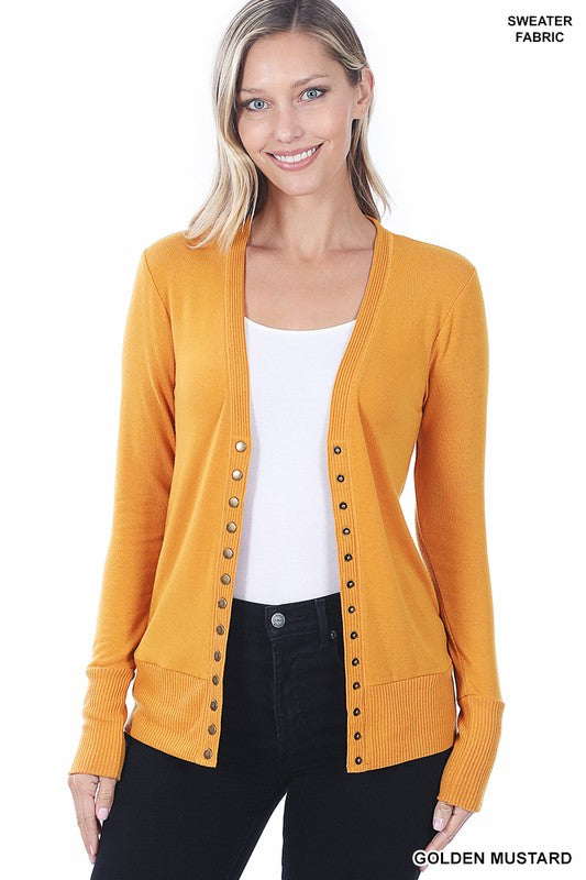 A stylish Snap Button Sweater Cardigan with ribbed texture, featuring button detailing and side pockets, available in various colors.