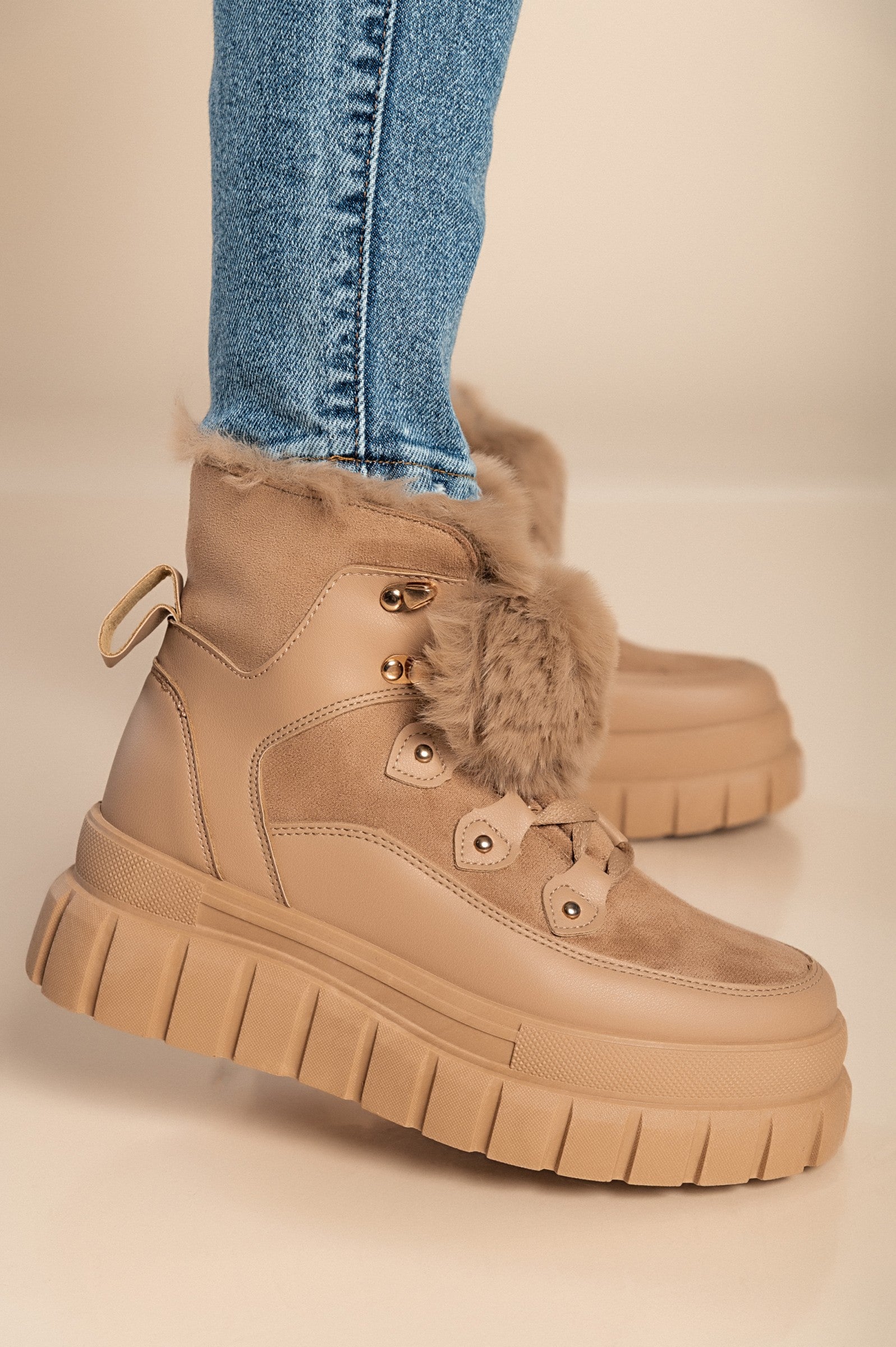 Khaki sneakers with synthetic fur lining around the ankle, featuring a raised sole and round toe design, perfect for casual wear.