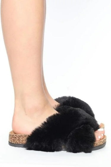 A pair of stylish Soft Fur Slide Sandals featuring a plush faux fur upper and a cork-style bottom, perfect for comfort and casual wear.