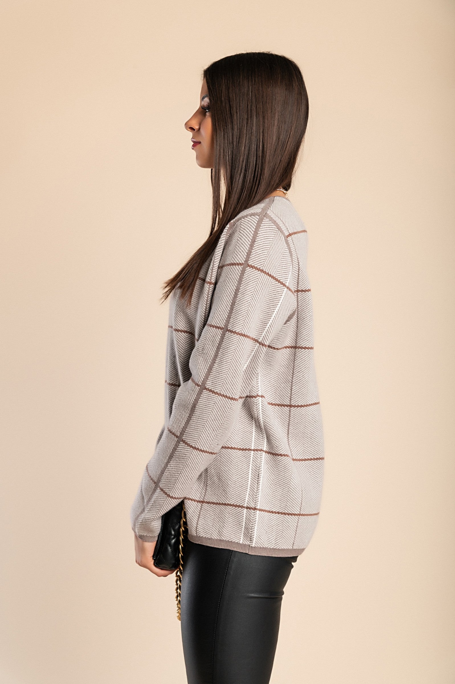 Cream soft sweater with check print, featuring long sleeves and a round neck, perfect for casual wear.