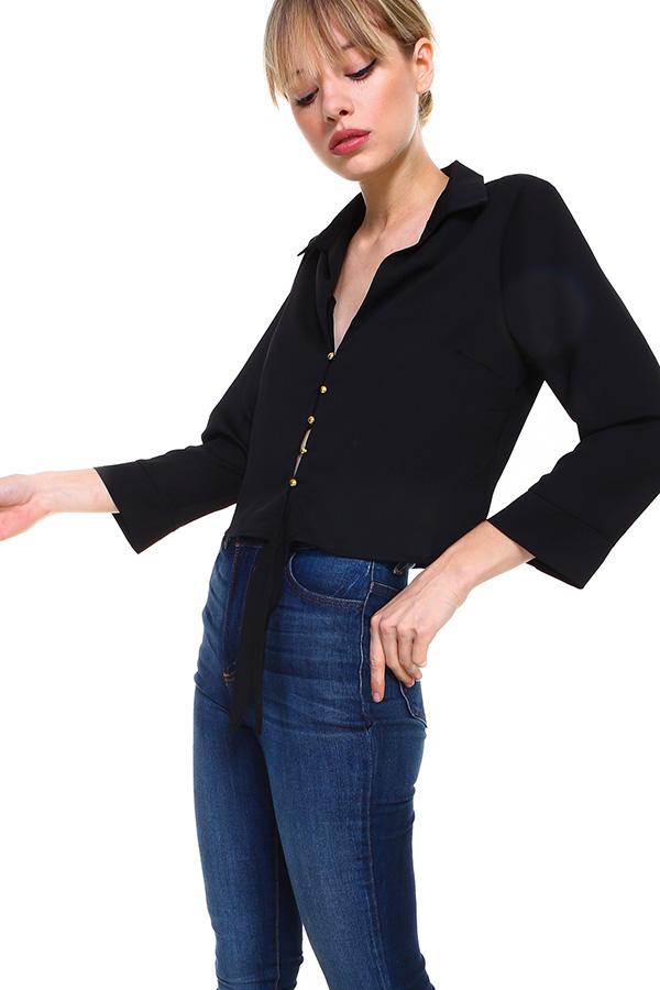A stylish Solid Button Down Tie Front Blouse featuring a tie front design, made from 100% polyester, available in various colors.