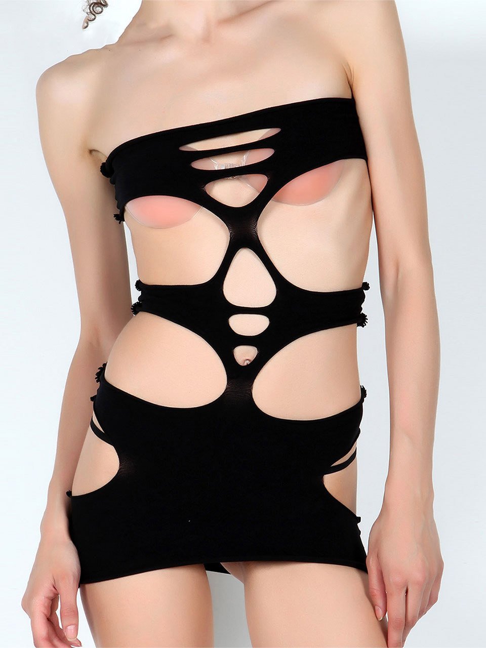 A stylish Solid Cutout Bodystocking featuring leg cut-outs and an elastic waistband, designed to accentuate curves.