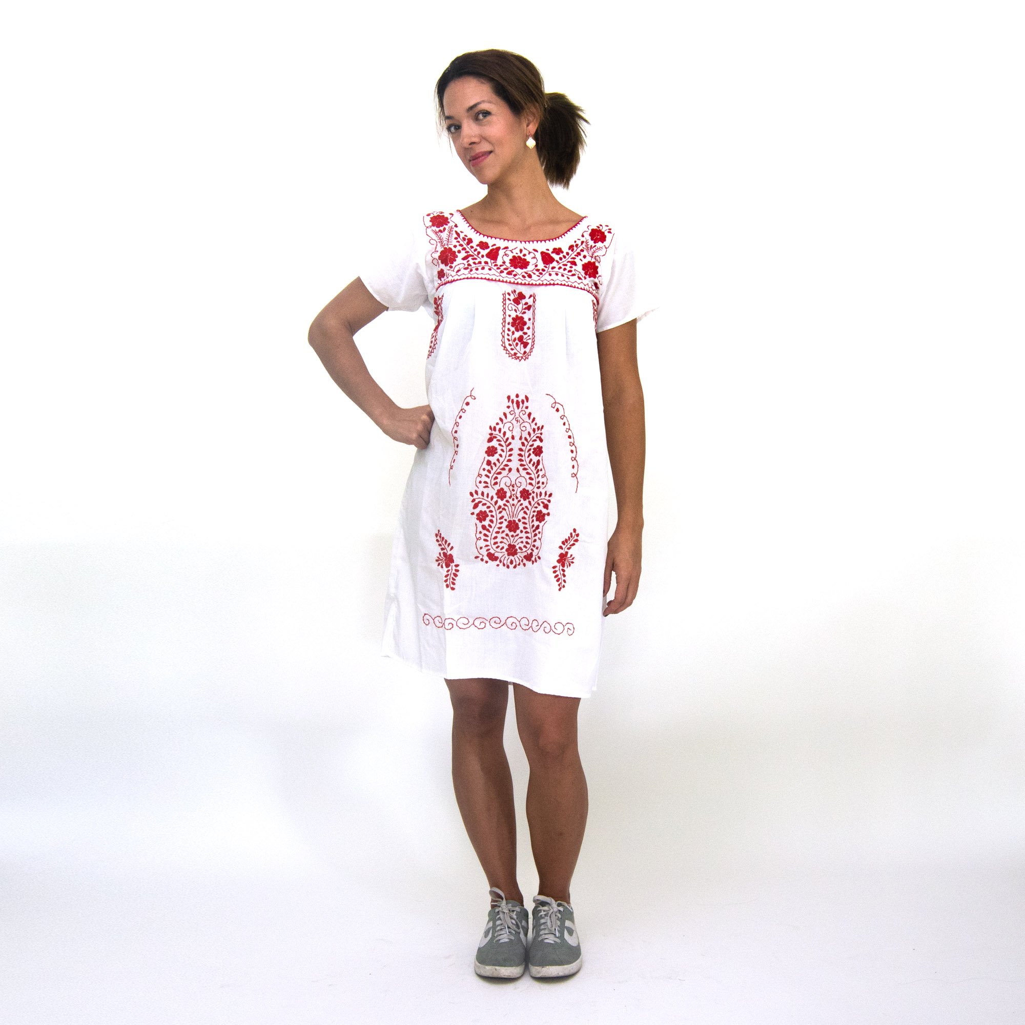 A beautiful Southwestern white dress adorned with vibrant red flowers, showcasing intricate hand embroidery, perfect for bohemian style.