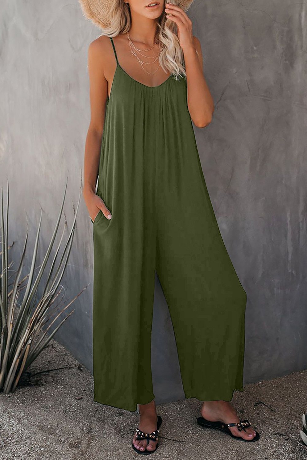 A stylish spaghetti straps wide leg jumpsuit with pockets, perfect for summer wear.