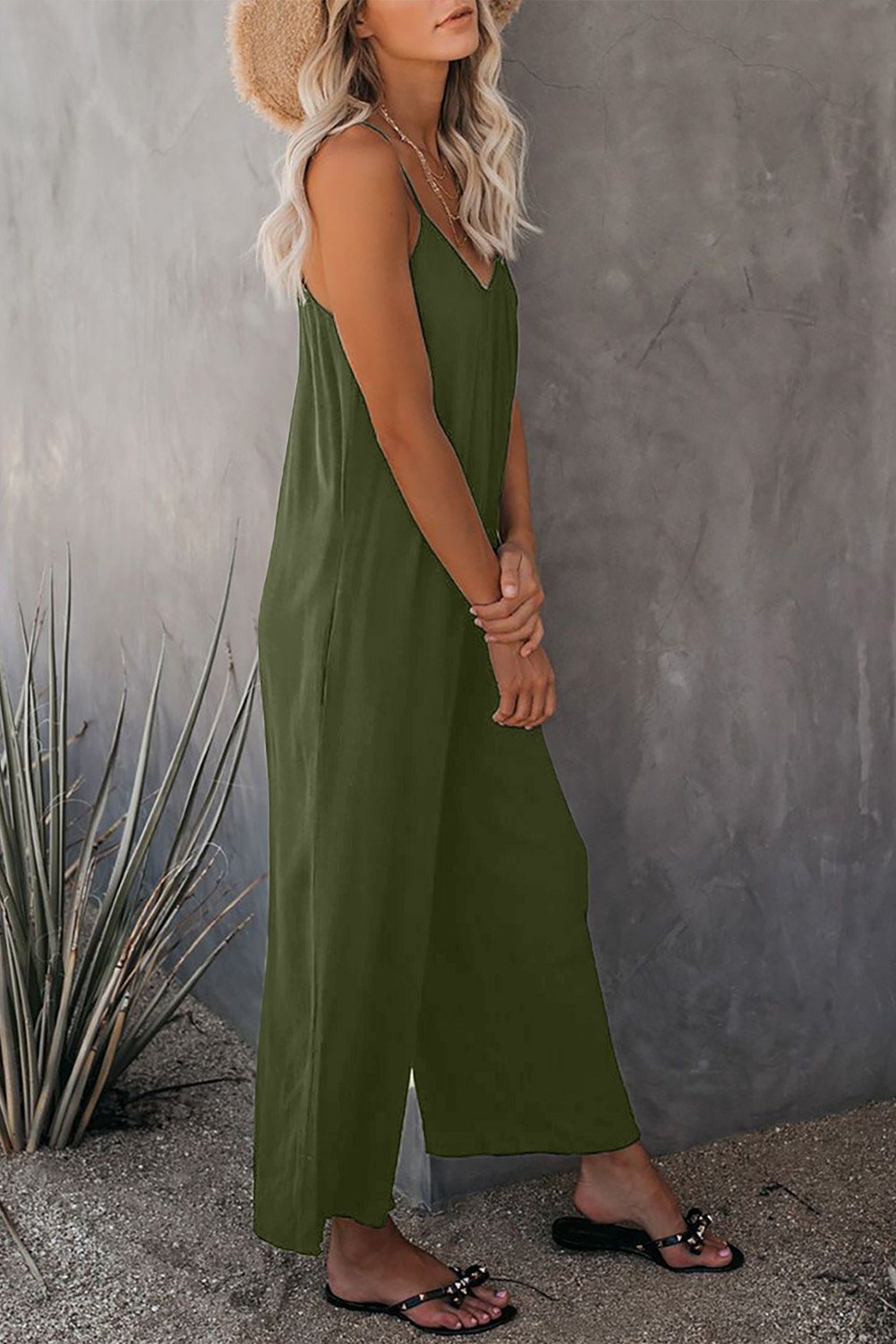 A stylish spaghetti straps wide leg jumpsuit with pockets, perfect for summer wear.