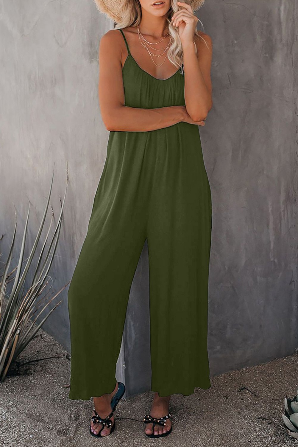 A stylish spaghetti straps wide leg jumpsuit with pockets, perfect for summer wear.