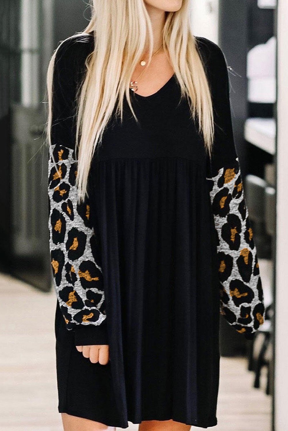 Splicing Ruffled V-neck Long Sleeve Mini Dress featuring a ruffled hemline and leopard splicing sleeves, perfect for stylish occasions.