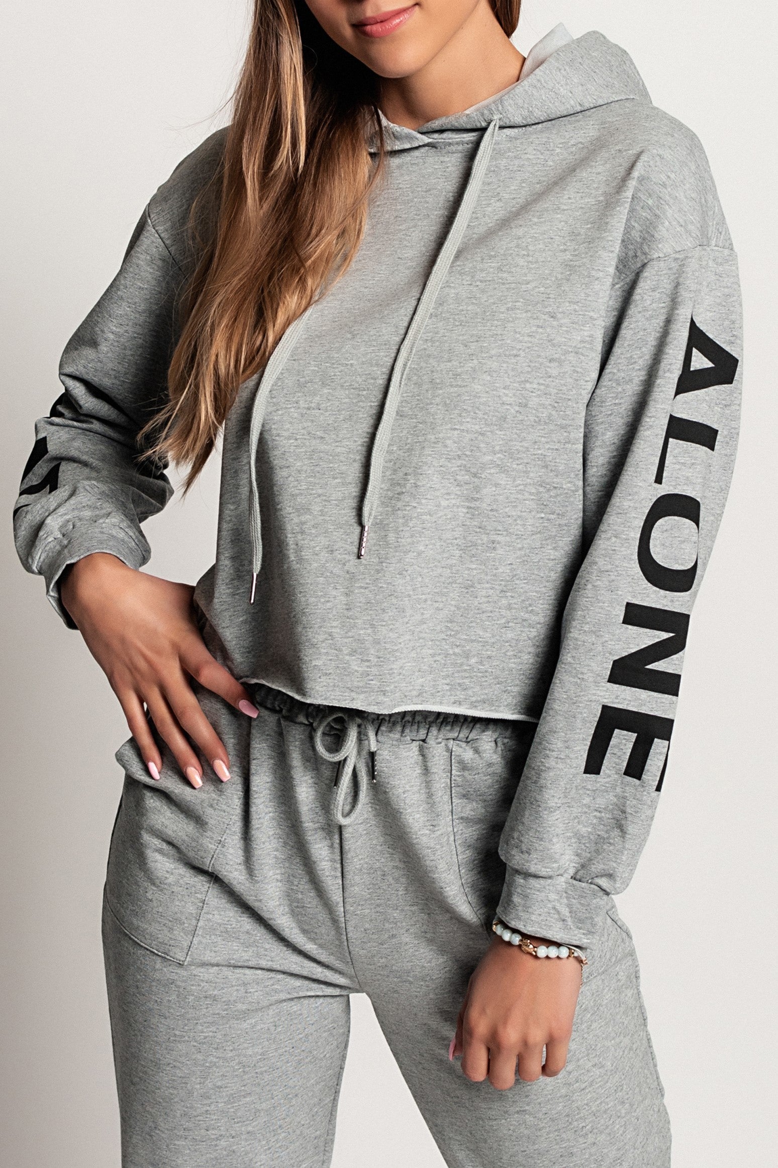 Sporty gray hoodie featuring Gioiosa print on sleeves and drawstring hood, perfect for casual and athletic wear.