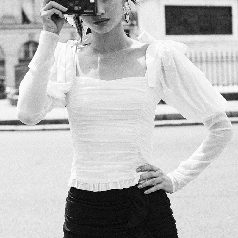 Elegant white blouse with square collar and puff sleeves, featuring a stylish bow, perfect for women's fashion.
