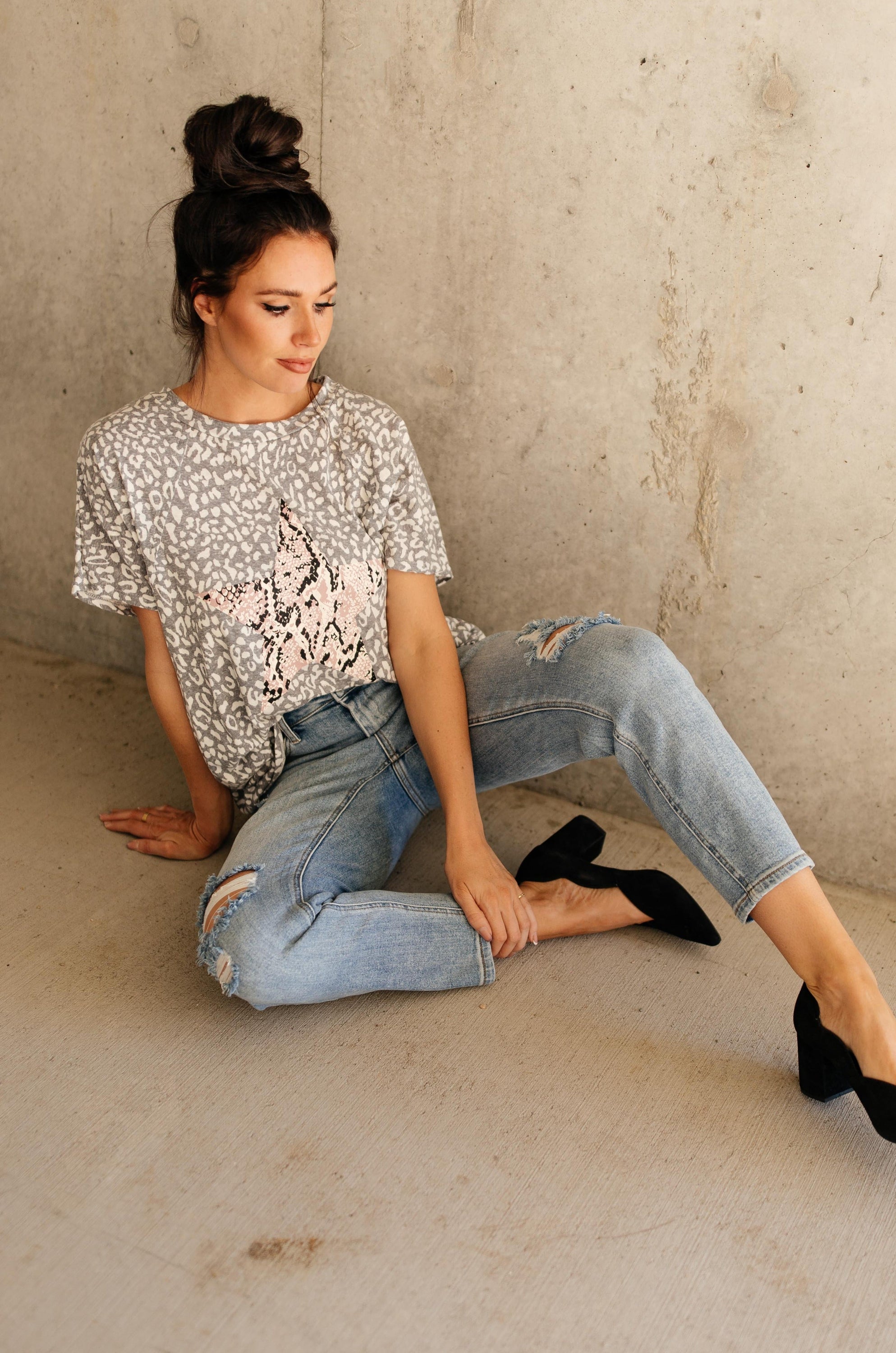 Star Of The Animal Show Top in Charcoal featuring leopard and snake prints, round neckline, and short sleeves.