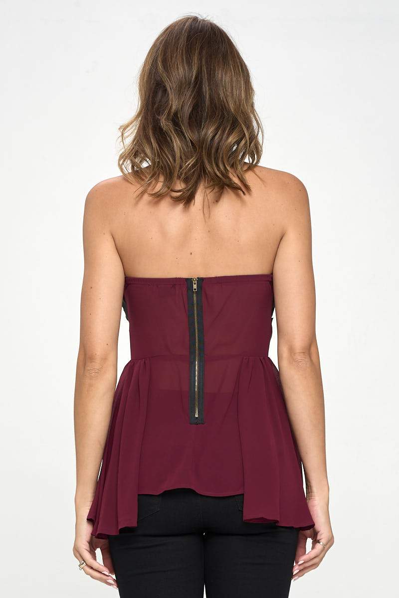 Strapless laser-cut chiffon peplum top for women, featuring a color block design and elegant silhouette.