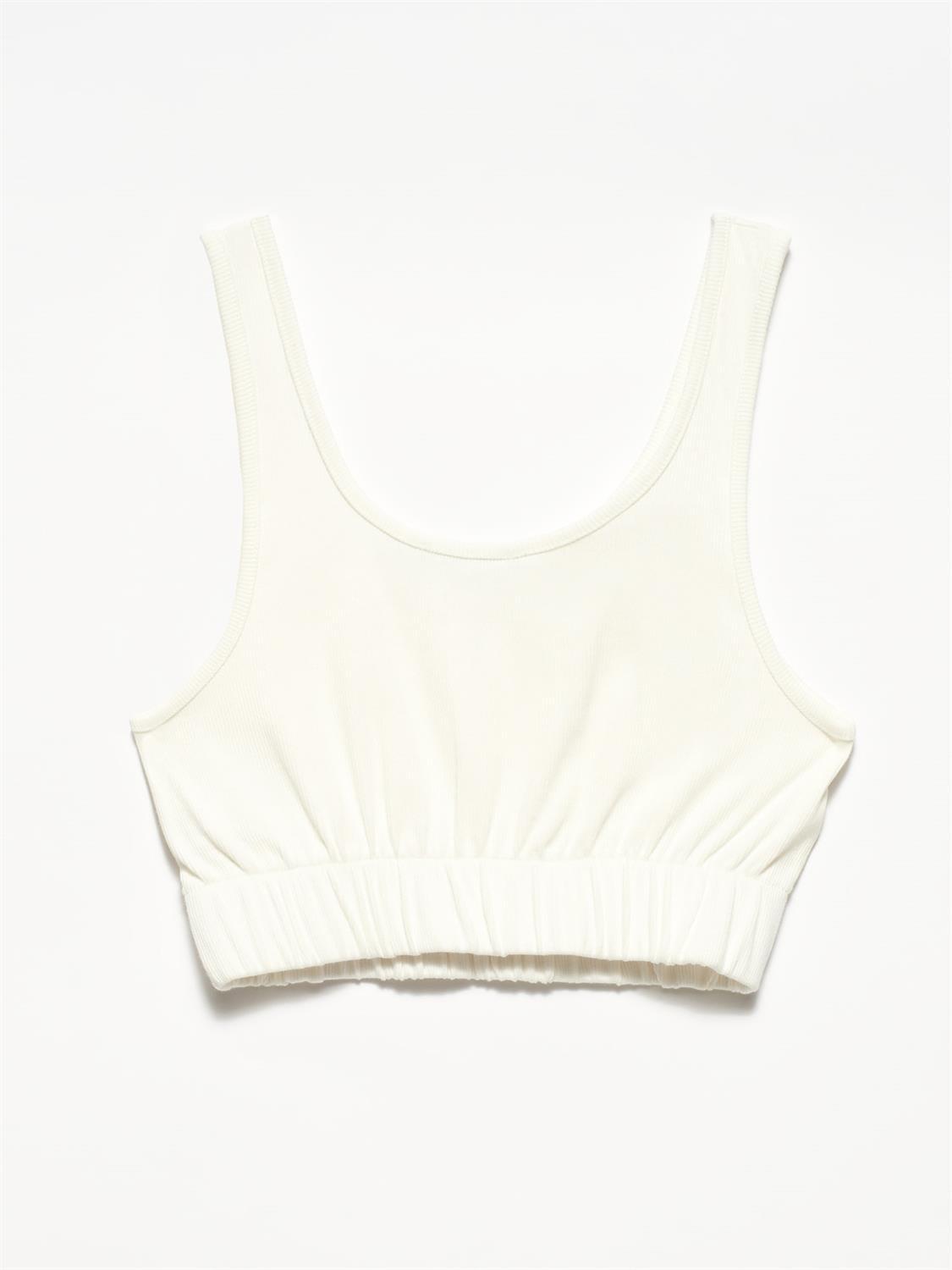 A stylish strappy top made from 96% cotton and 4% elastane, featuring thin straps and a comfortable fit.