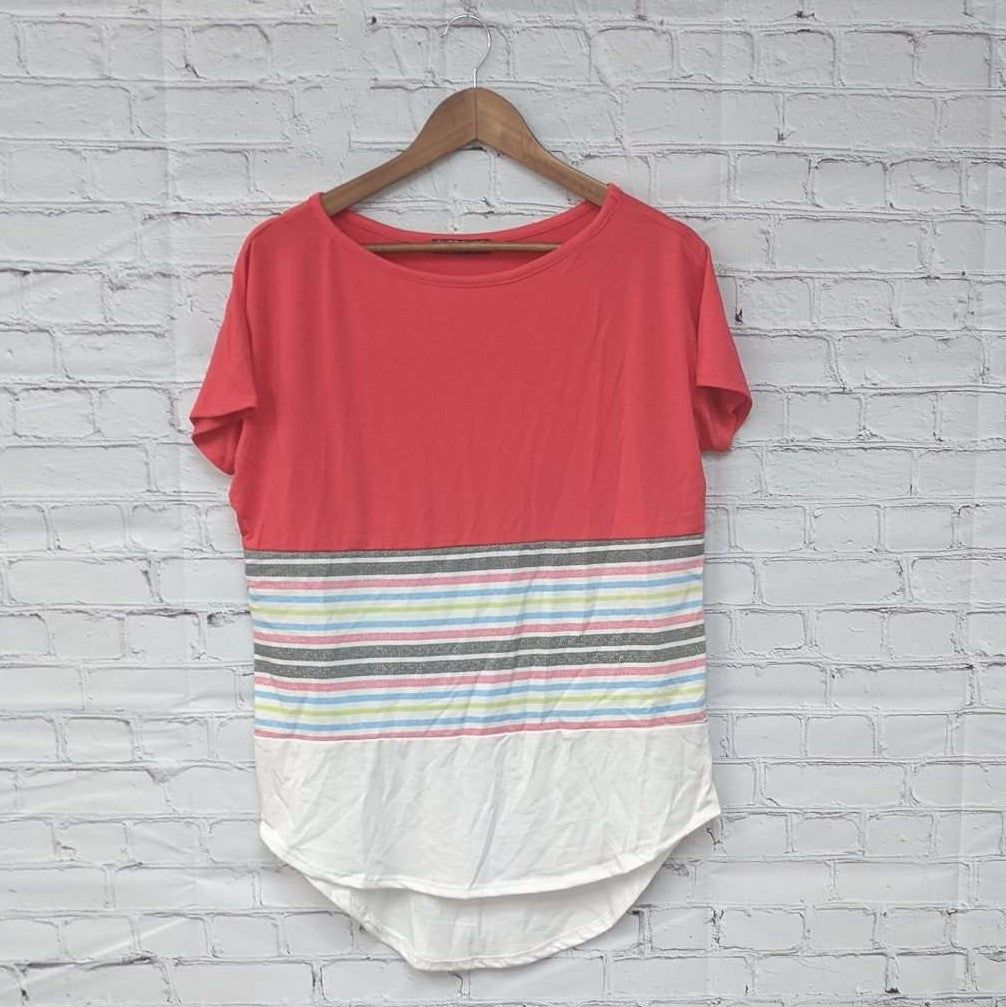 A stylish striped colorblock top featuring a blend of colors and comfortable fabric, perfect for casual and dressy occasions.