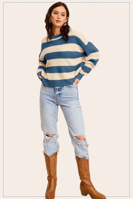 A stylish striped round neck loose fit sweater in a casual design, featuring long sleeves and a comfortable fit, perfect for everyday wear.