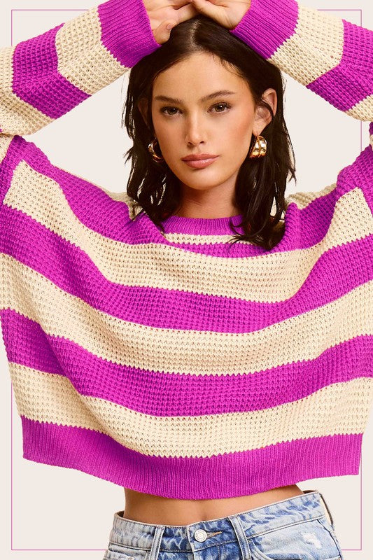 A stylish striped round neck loose fit sweater in a casual design, featuring long sleeves and a comfortable fit, perfect for everyday wear.