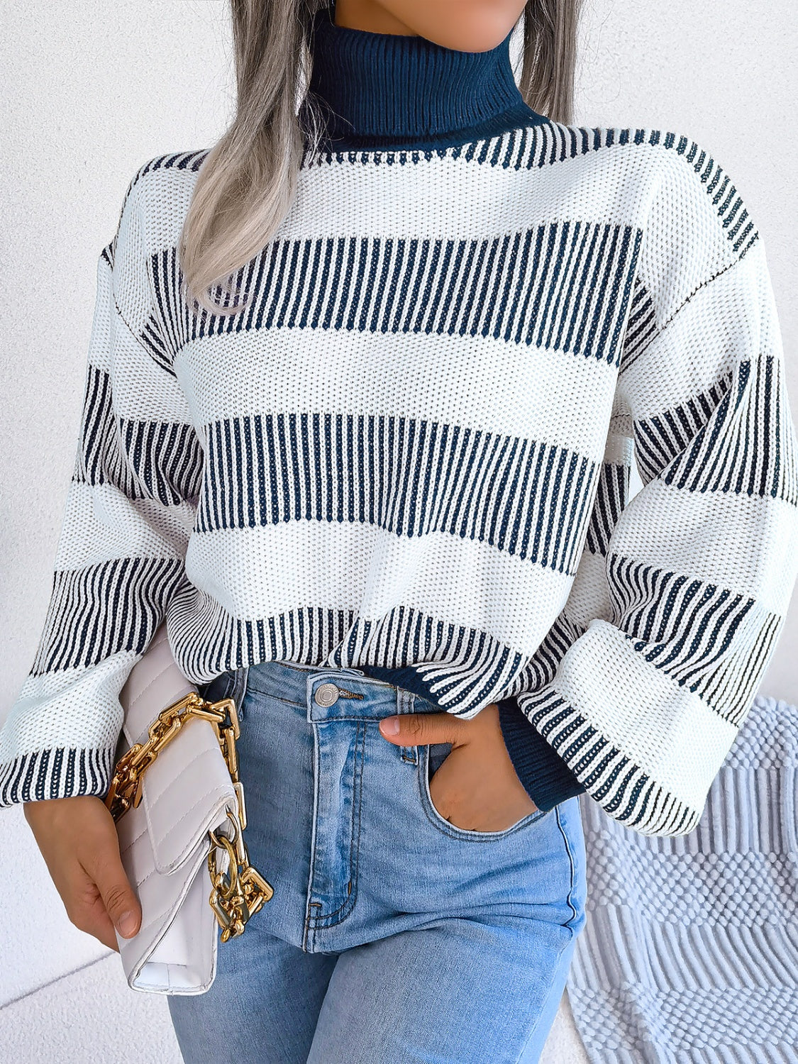 A cozy striped turtleneck long sleeve sweater in soft acrylic fabric, showcasing its stylish design and comfortable fit.