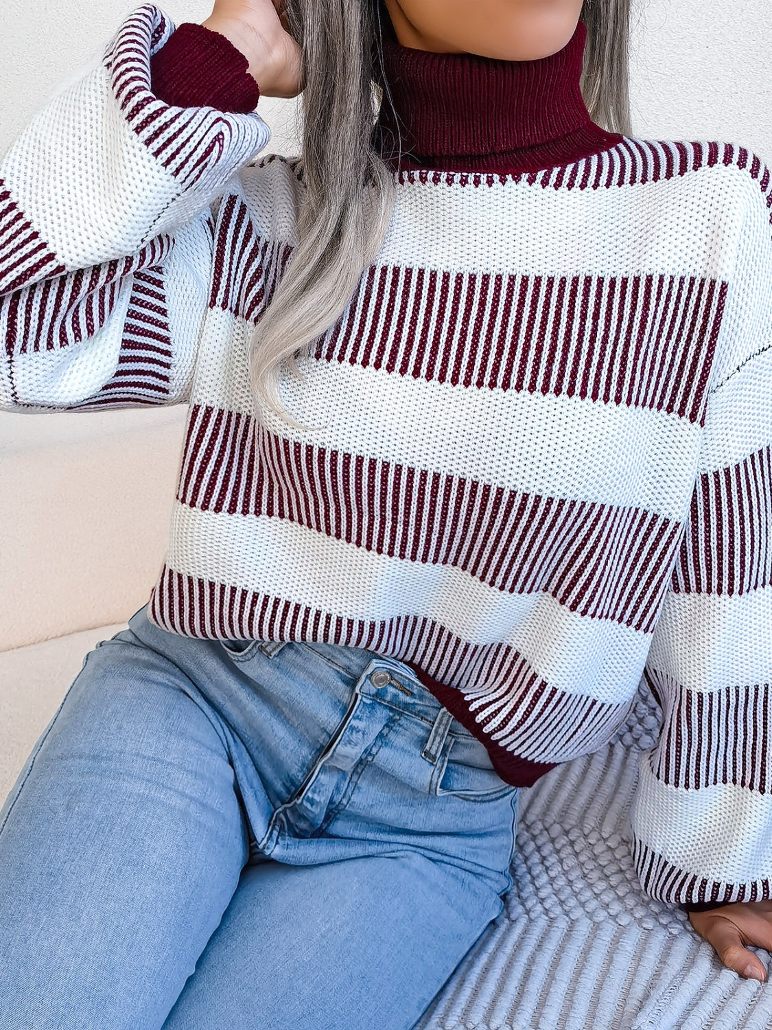 A cozy striped turtleneck long sleeve sweater in soft acrylic fabric, showcasing its stylish design and comfortable fit.