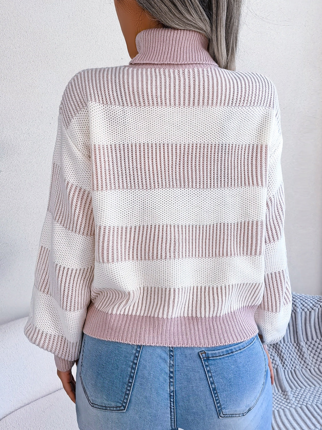 A cozy striped turtleneck long sleeve sweater in soft acrylic fabric, showcasing its stylish design and comfortable fit.