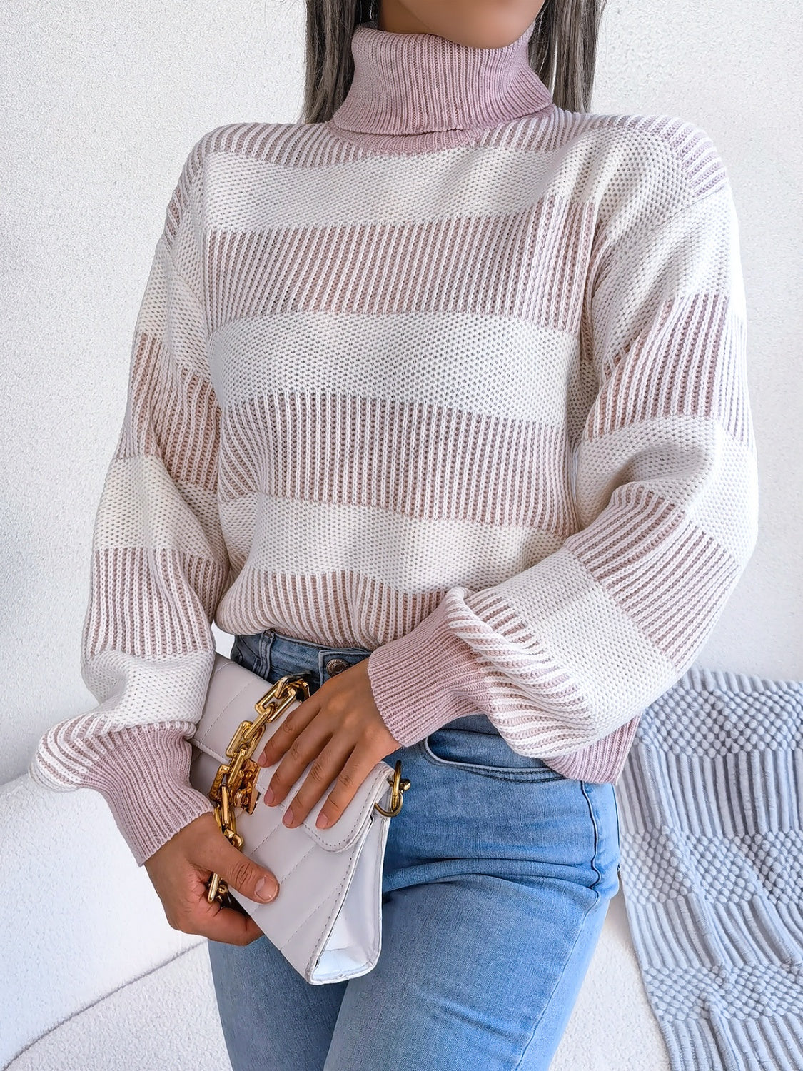 A cozy striped turtleneck long sleeve sweater in soft acrylic fabric, showcasing its stylish design and comfortable fit.
