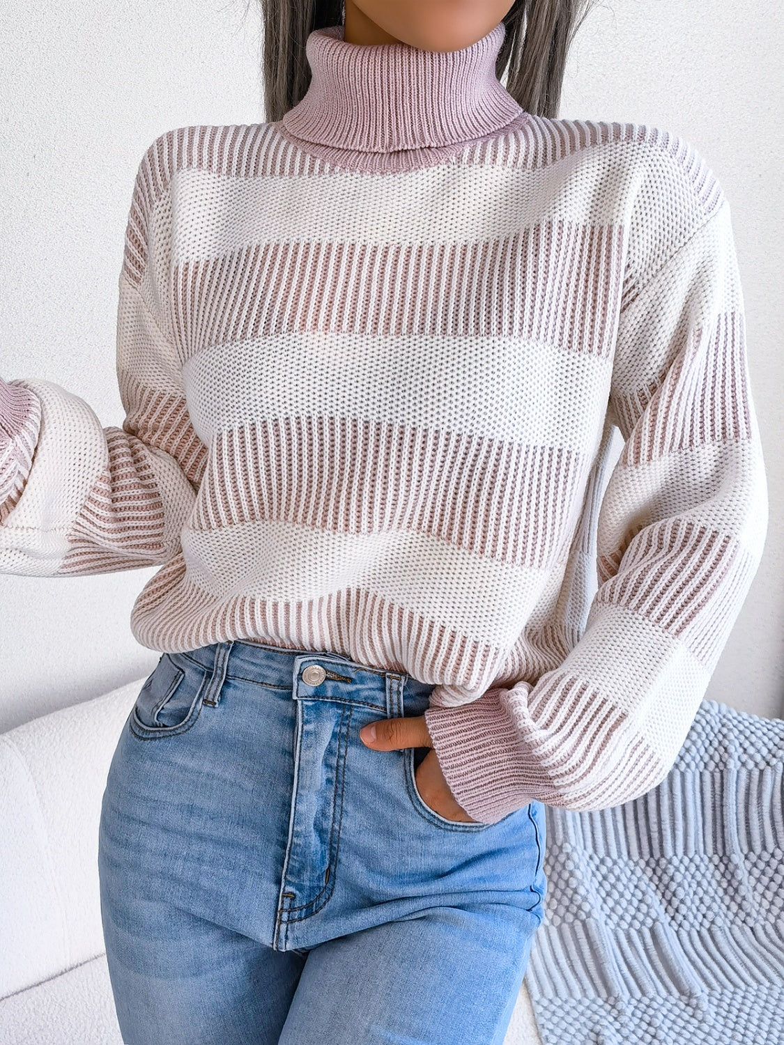 A cozy striped turtleneck long sleeve sweater in soft acrylic fabric, showcasing its stylish design and comfortable fit.