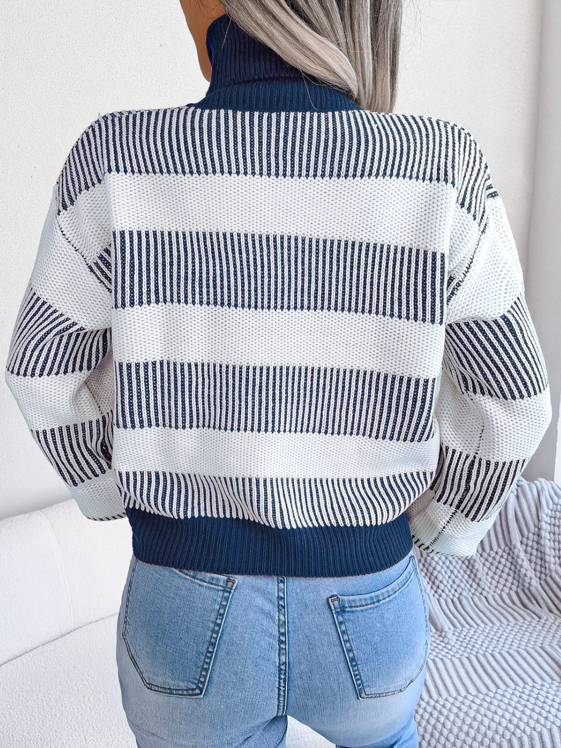 A cozy striped turtleneck long sleeve sweater in soft acrylic fabric, showcasing its stylish design and comfortable fit.