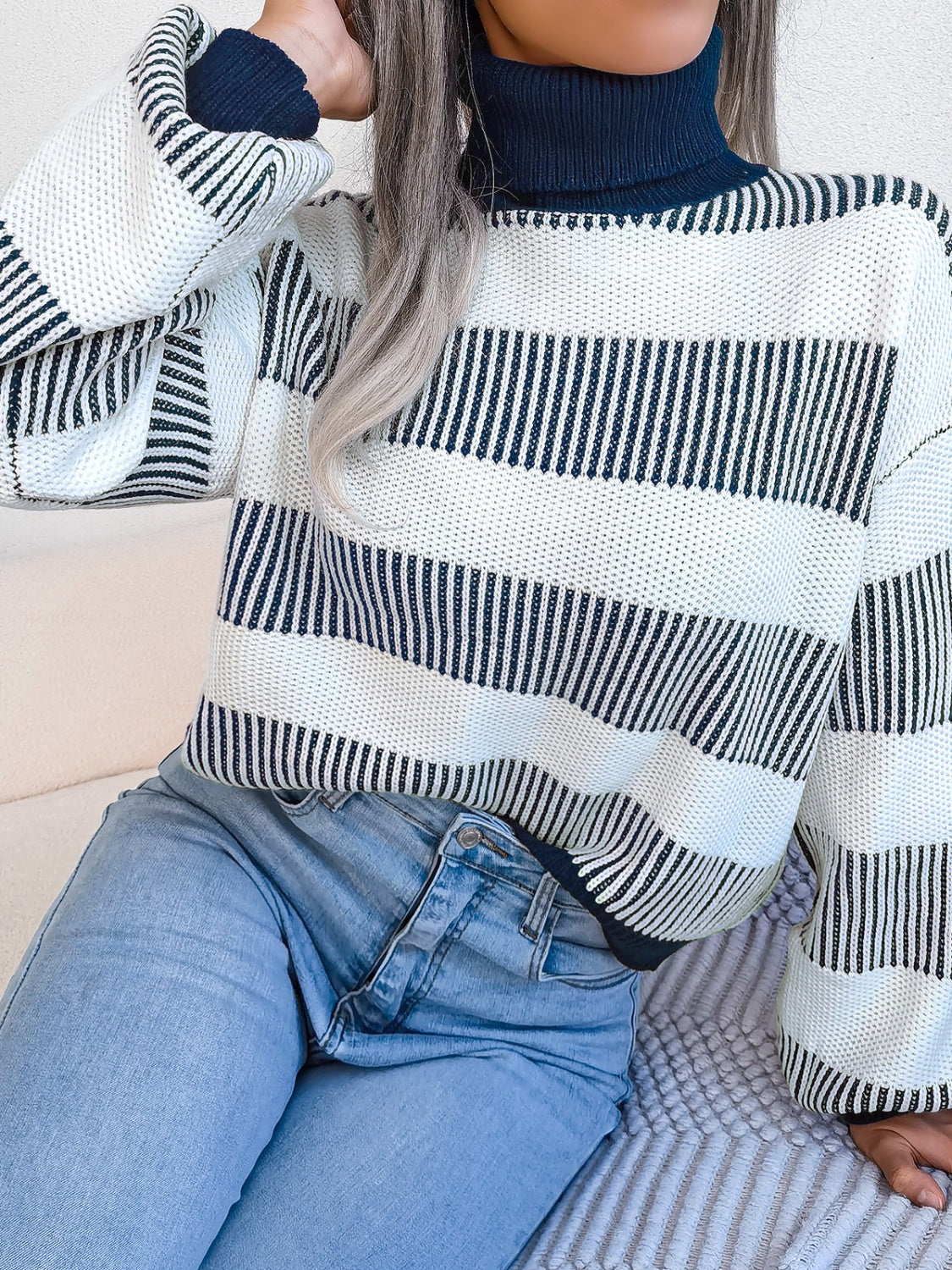 A cozy striped turtleneck long sleeve sweater in soft acrylic fabric, showcasing its stylish design and comfortable fit.