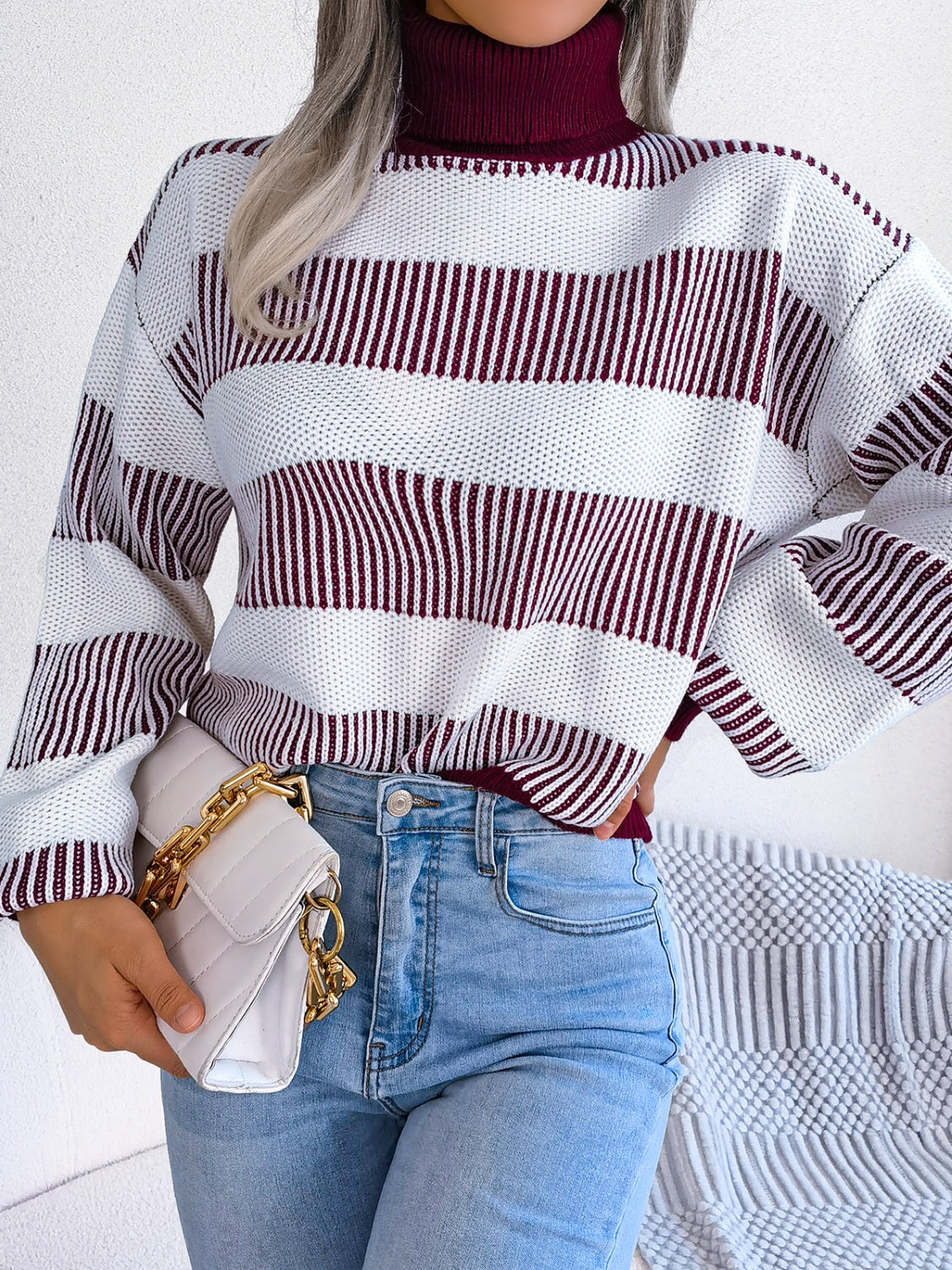 A cozy striped turtleneck long sleeve sweater in soft acrylic fabric, showcasing its stylish design and comfortable fit.