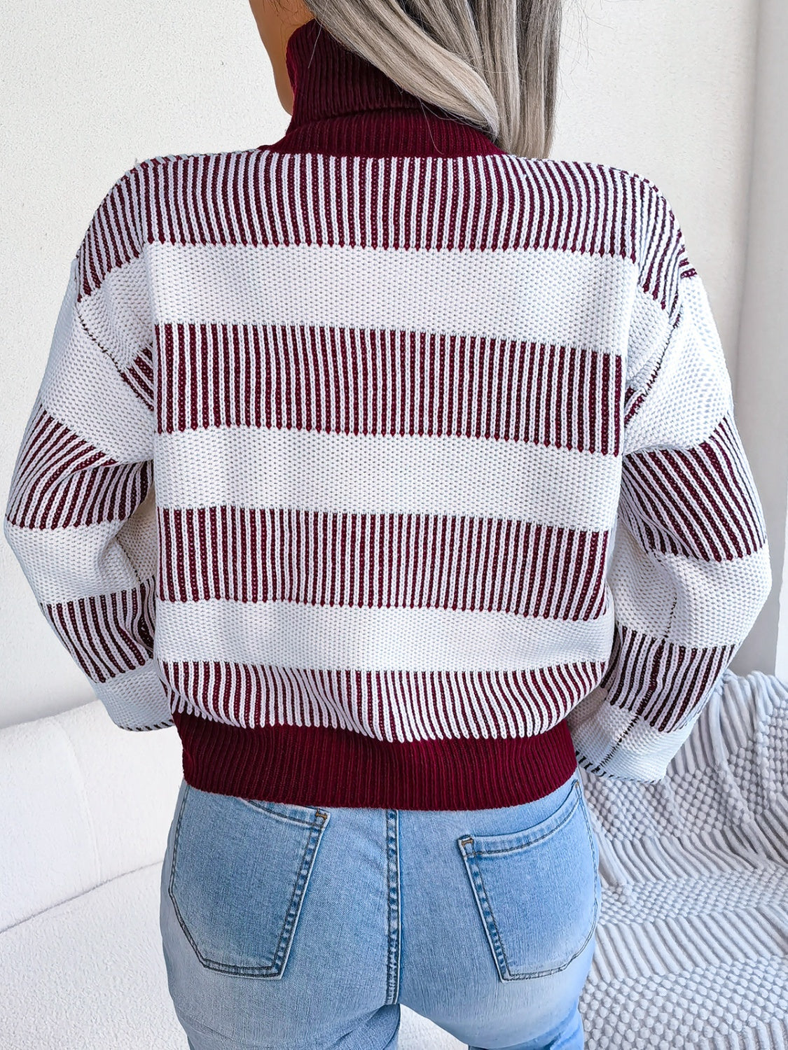 A cozy striped turtleneck long sleeve sweater in soft acrylic fabric, showcasing its stylish design and comfortable fit.