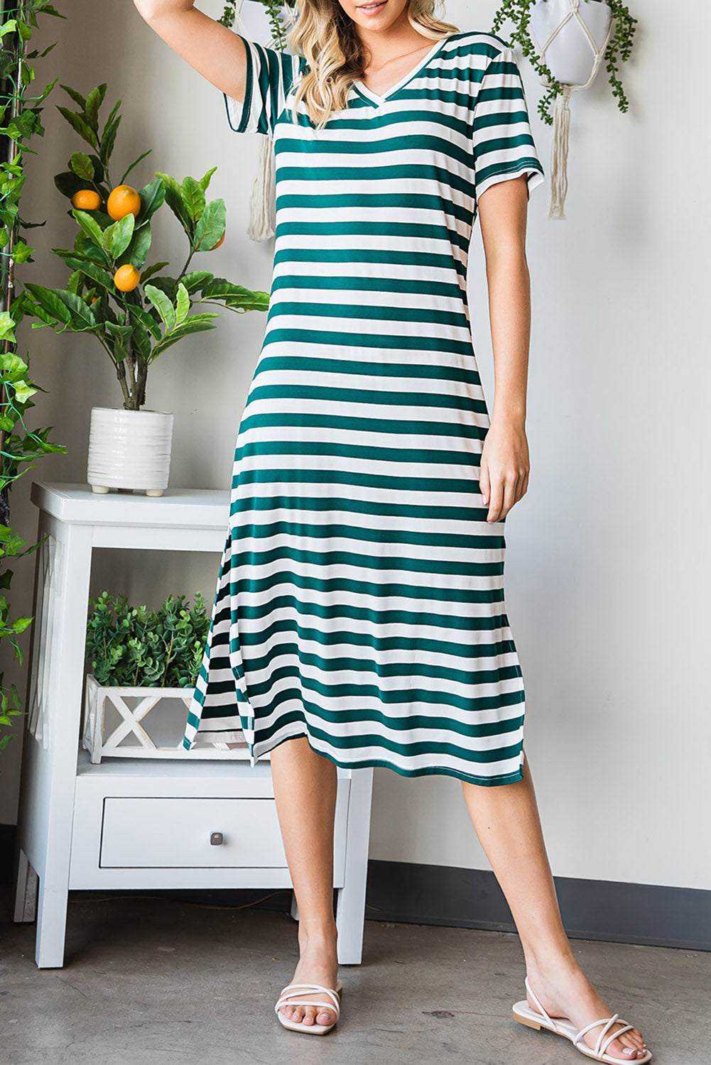 A stylish striped V-neck short sleeve dress with a side slit, perfect for casual outings.