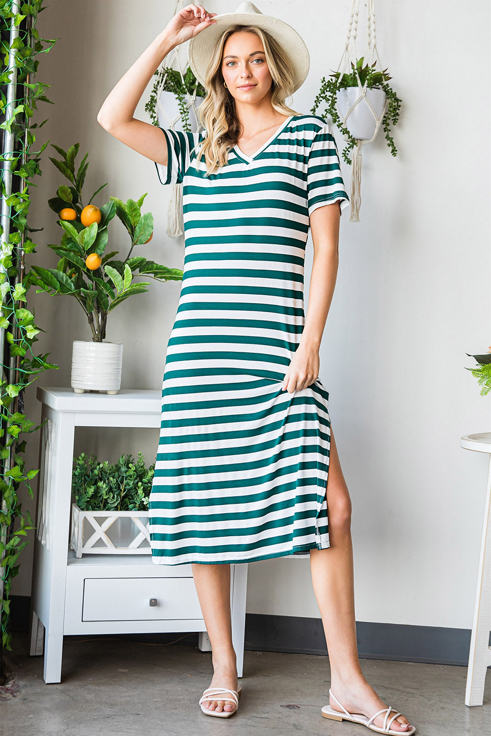 A stylish striped V-neck short sleeve dress with a side slit, perfect for casual outings.