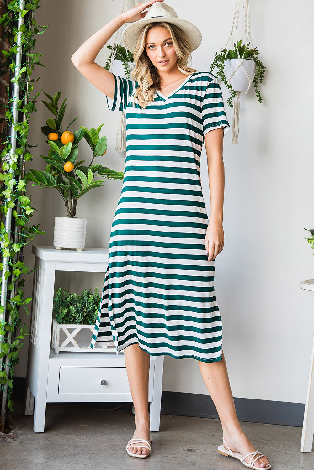 A stylish striped V-neck short sleeve dress with a side slit, perfect for casual outings.