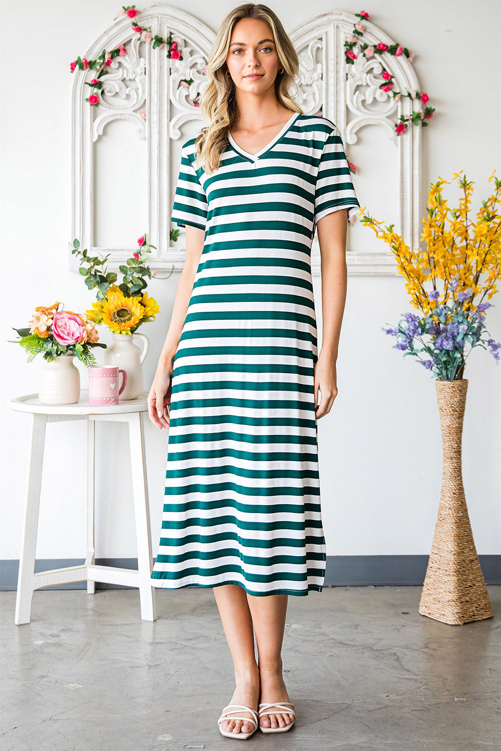 A stylish striped V-neck short sleeve dress with a side slit, perfect for casual outings.