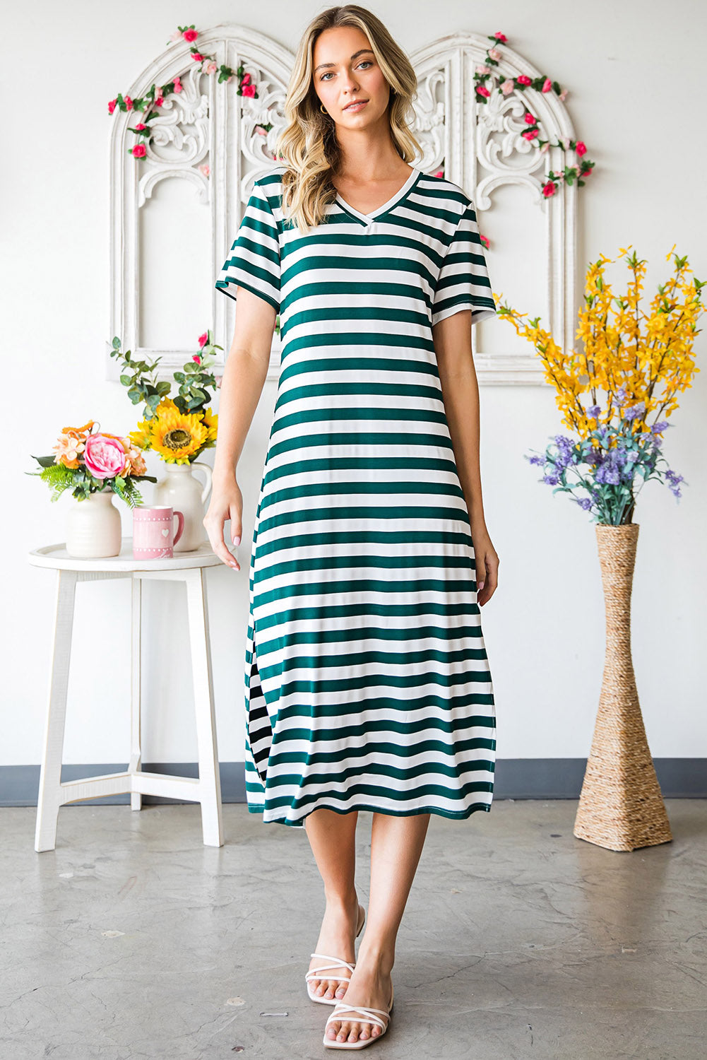 A stylish striped V-neck short sleeve dress with a side slit, perfect for casual outings.