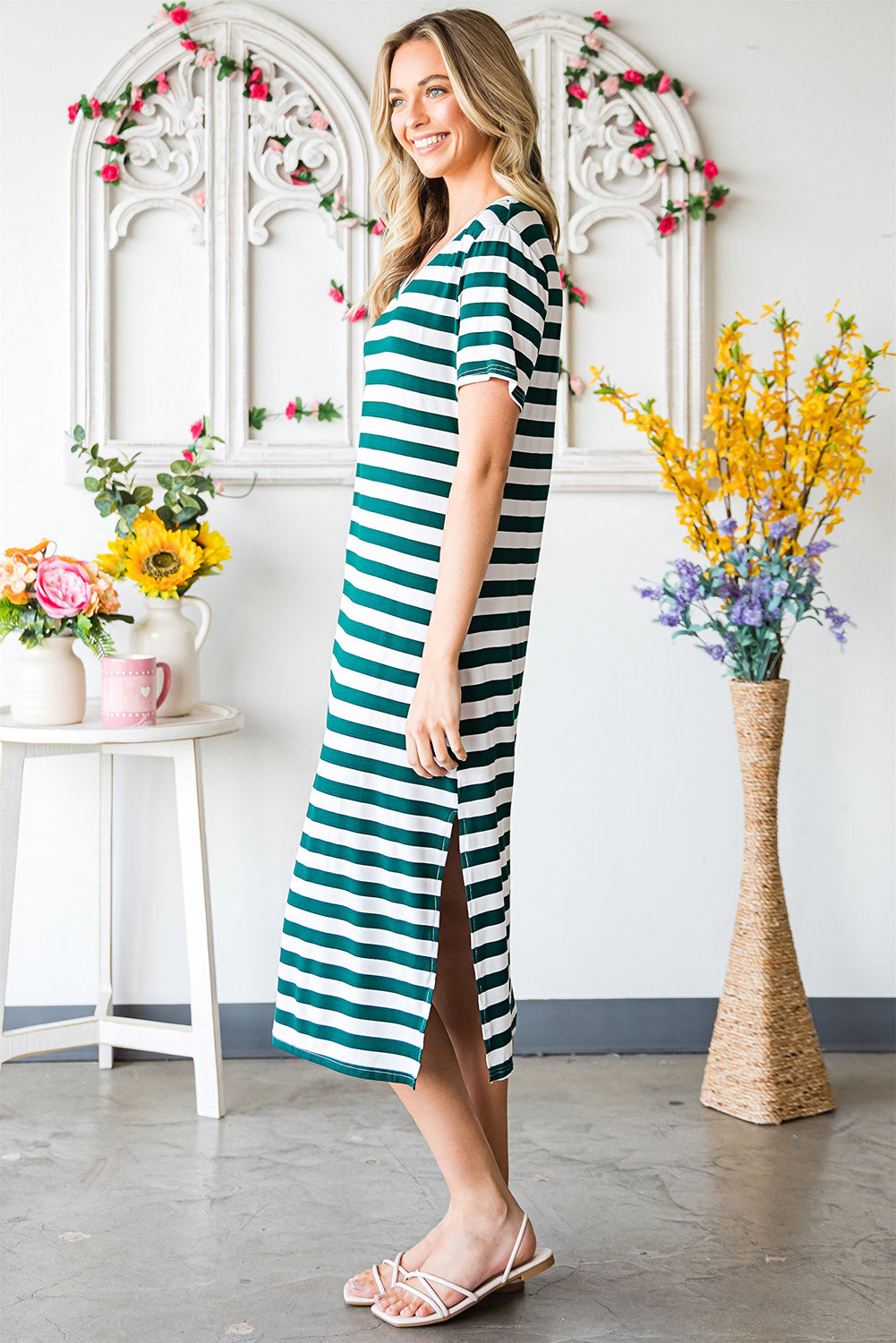 A stylish striped V-neck short sleeve dress with a side slit, perfect for casual outings.