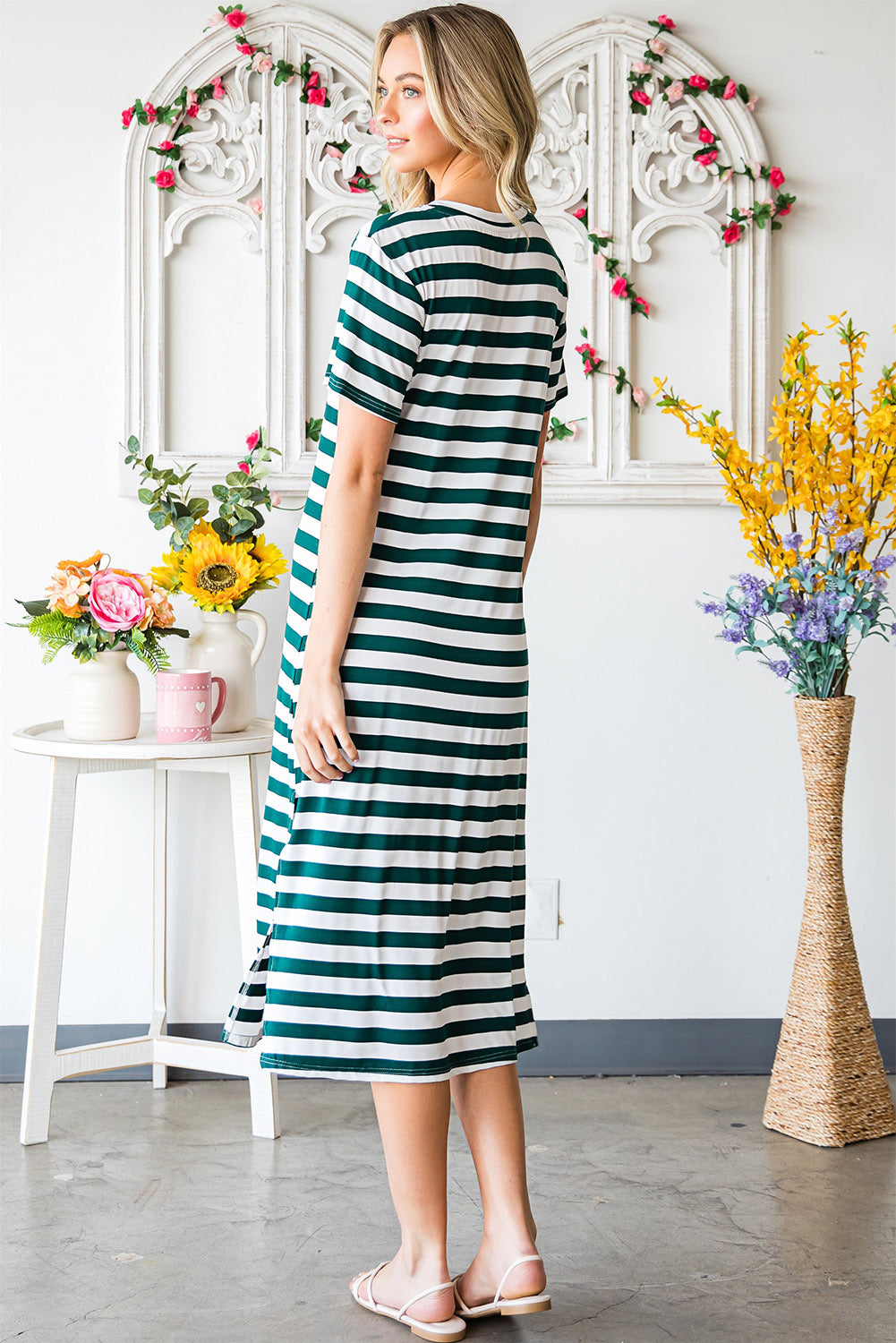 A stylish striped V-neck short sleeve dress with a side slit, perfect for casual outings.