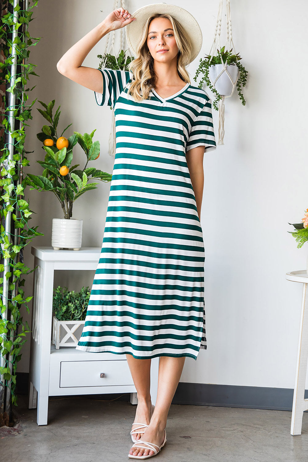 A stylish striped V-neck short sleeve dress with a side slit, perfect for casual outings.