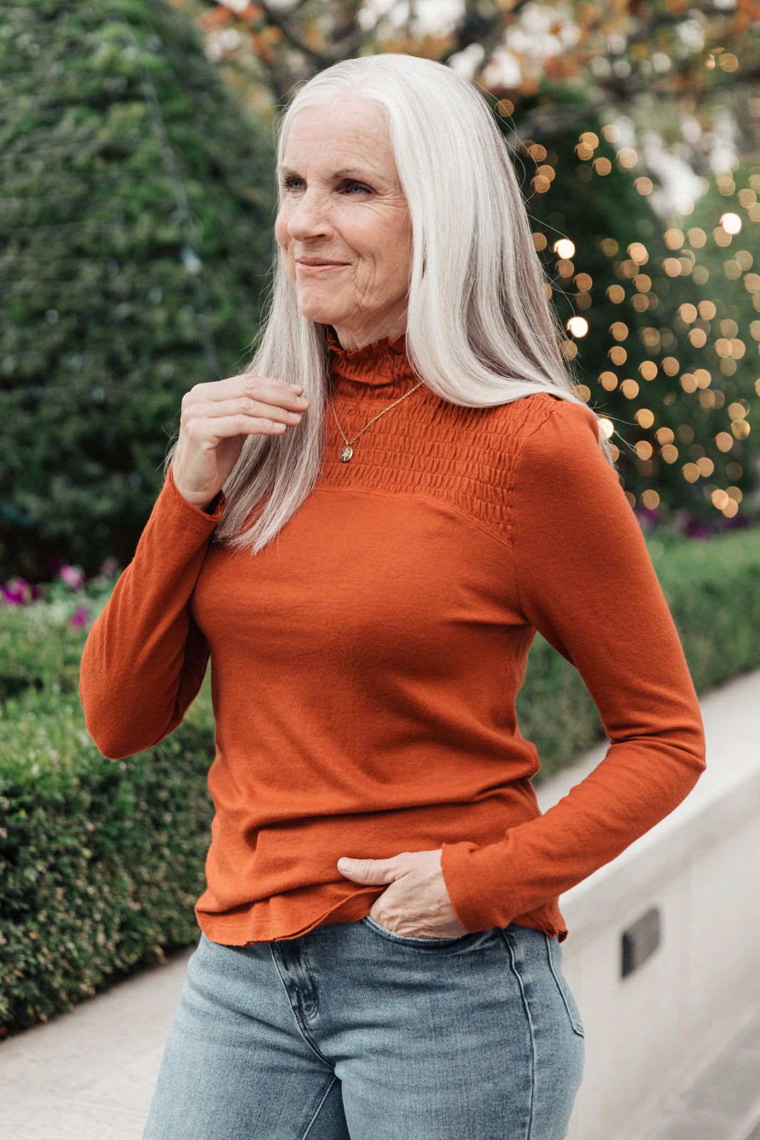 Stylin Girl Turtleneck in Rust featuring ruched neckline and fitted long sleeves, perfect for layering.