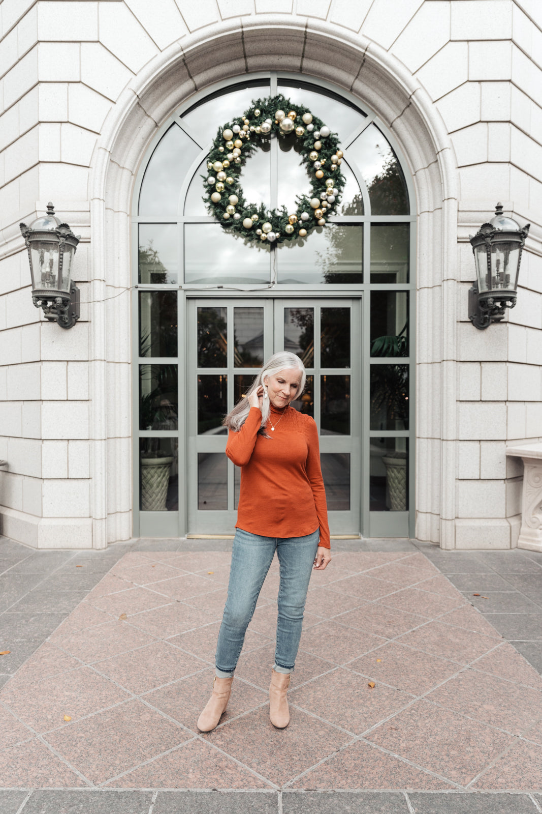 Stylin Girl Turtleneck in Rust featuring ruched neckline and fitted long sleeves, perfect for layering.