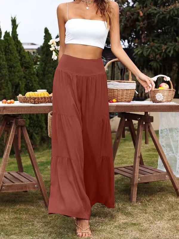 A pair of stylish summer casual wide leg trousers made from cotton and linen, featuring a high waist and loose fit, perfect for warm weather.