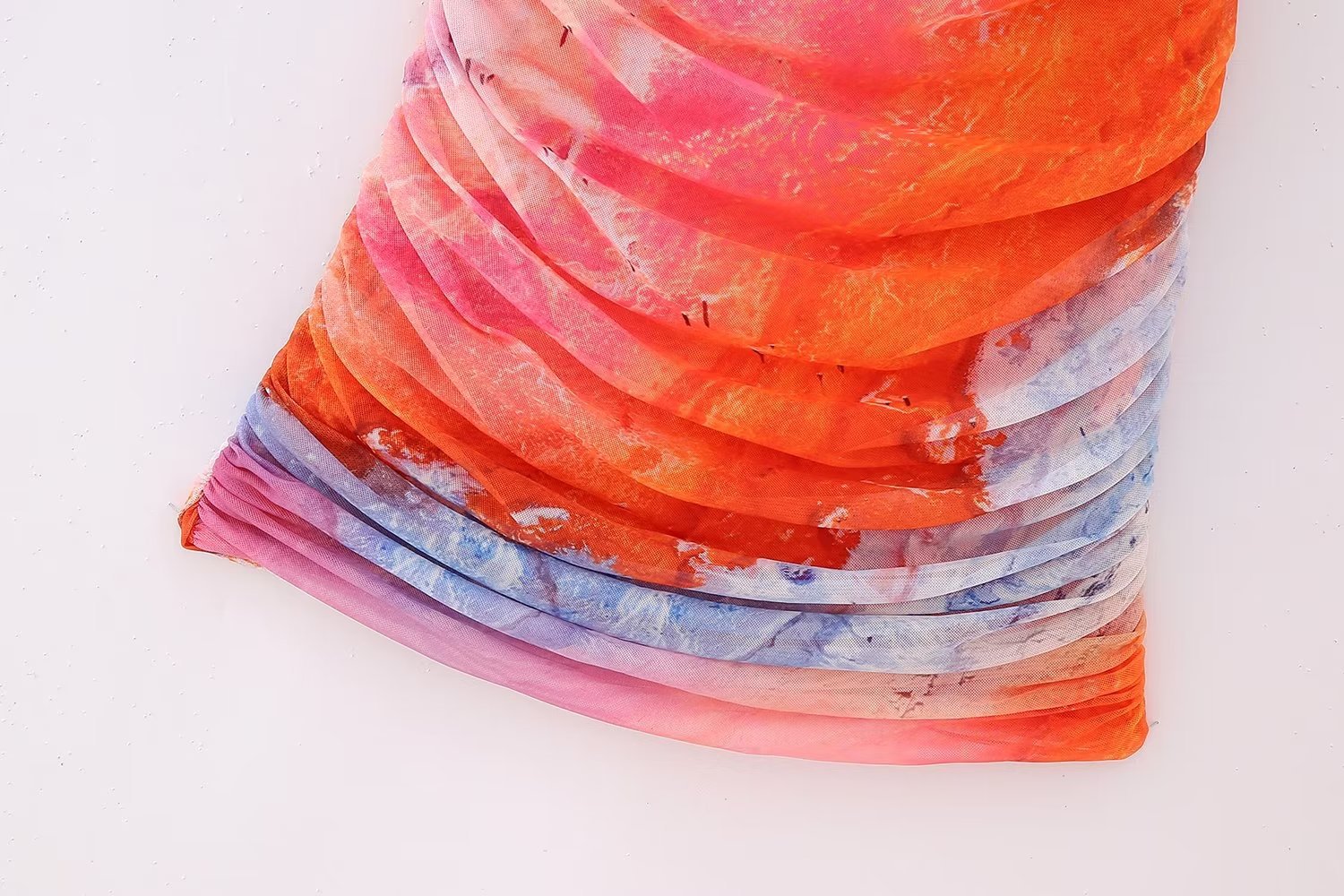 A stylish Summer Pleated Tulle Dress for women featuring an asymmetrical neckline and pleated design, perfect for beach outings.