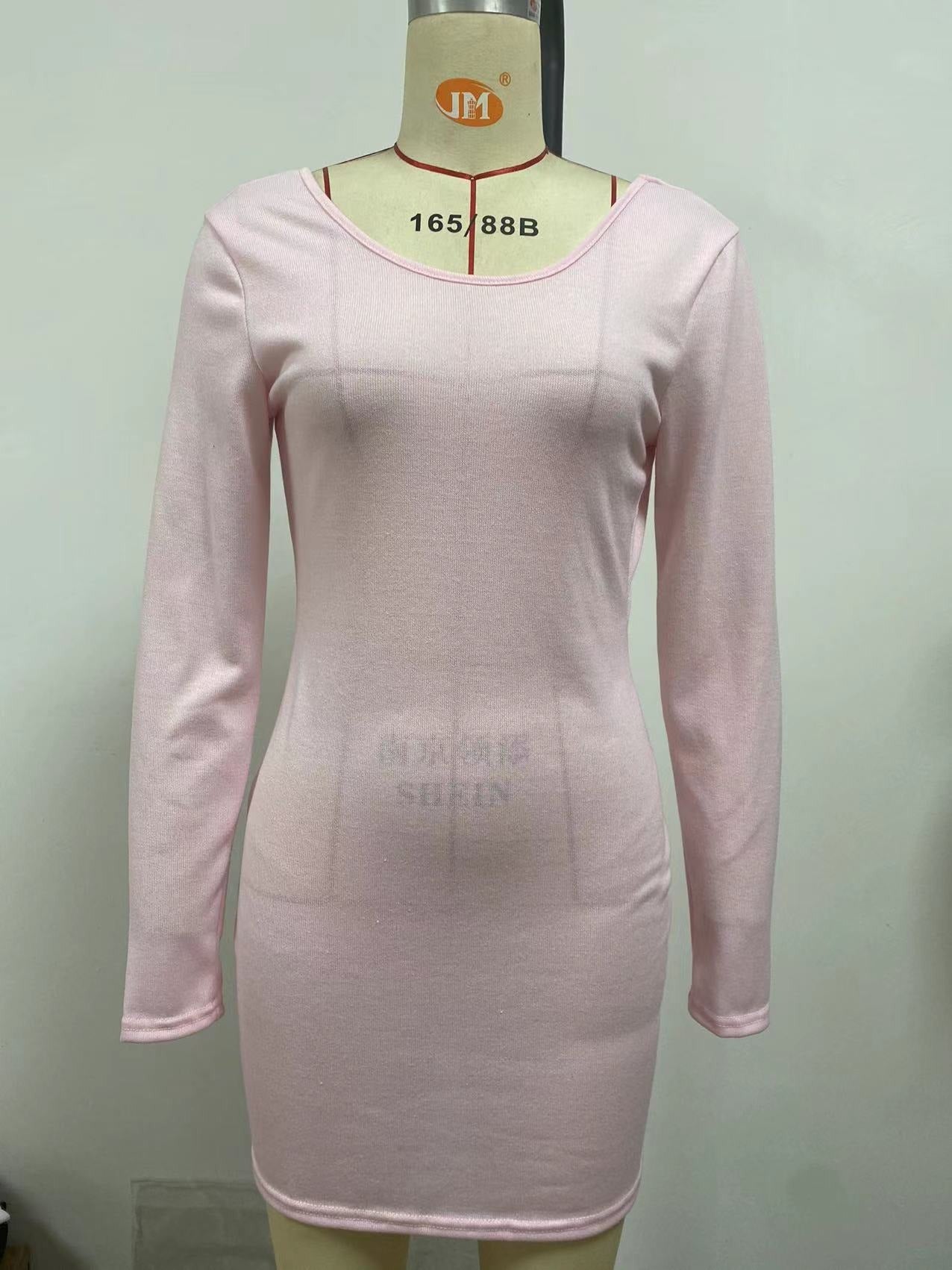 A stylish summer dress featuring a sexy open back design, solid color, and A-line skirt, perfect for warm weather occasions.