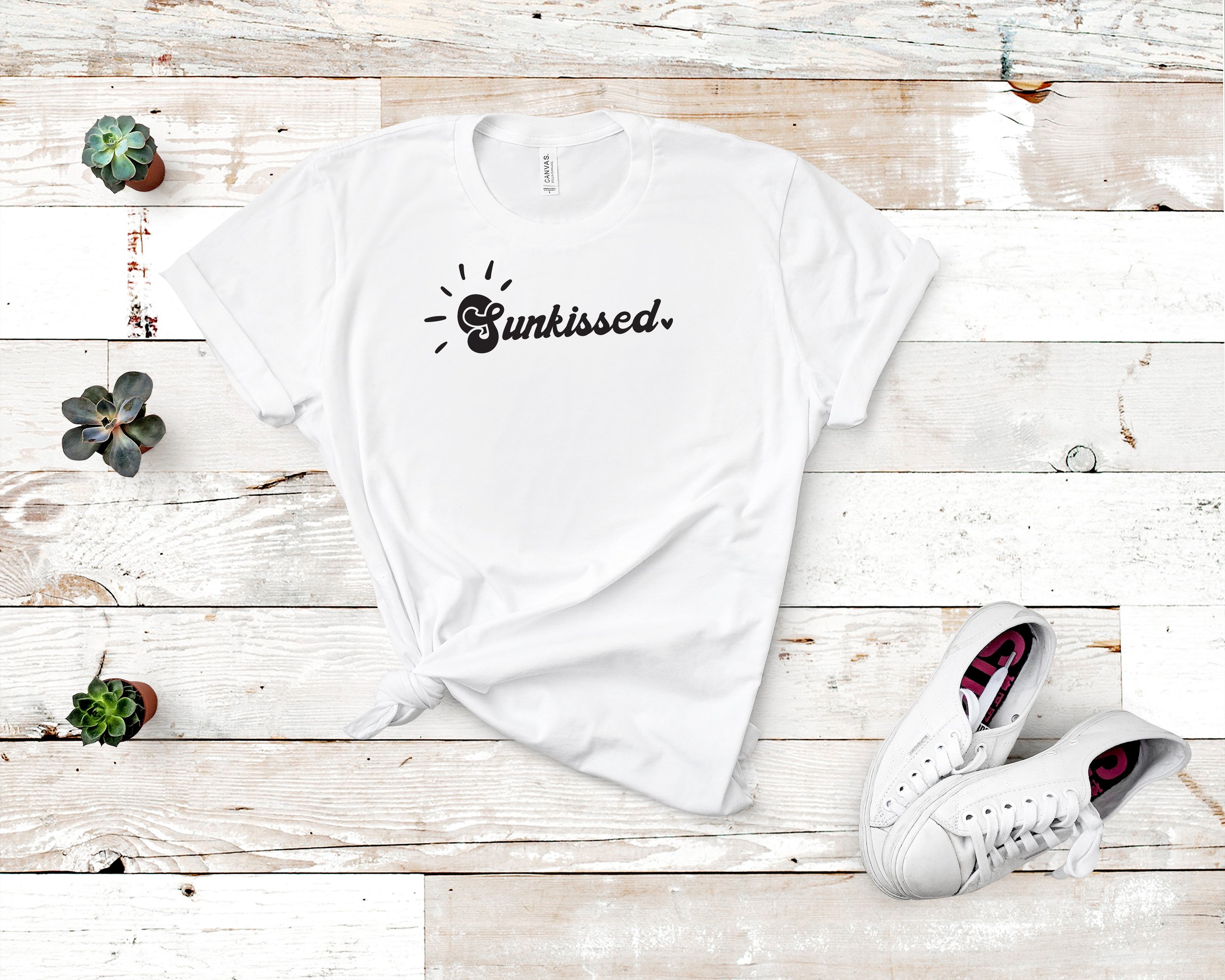 A stylish Sunkissed Tee featuring a vibrant design, made in the USA, showcasing its unisex fit and soft fabric.