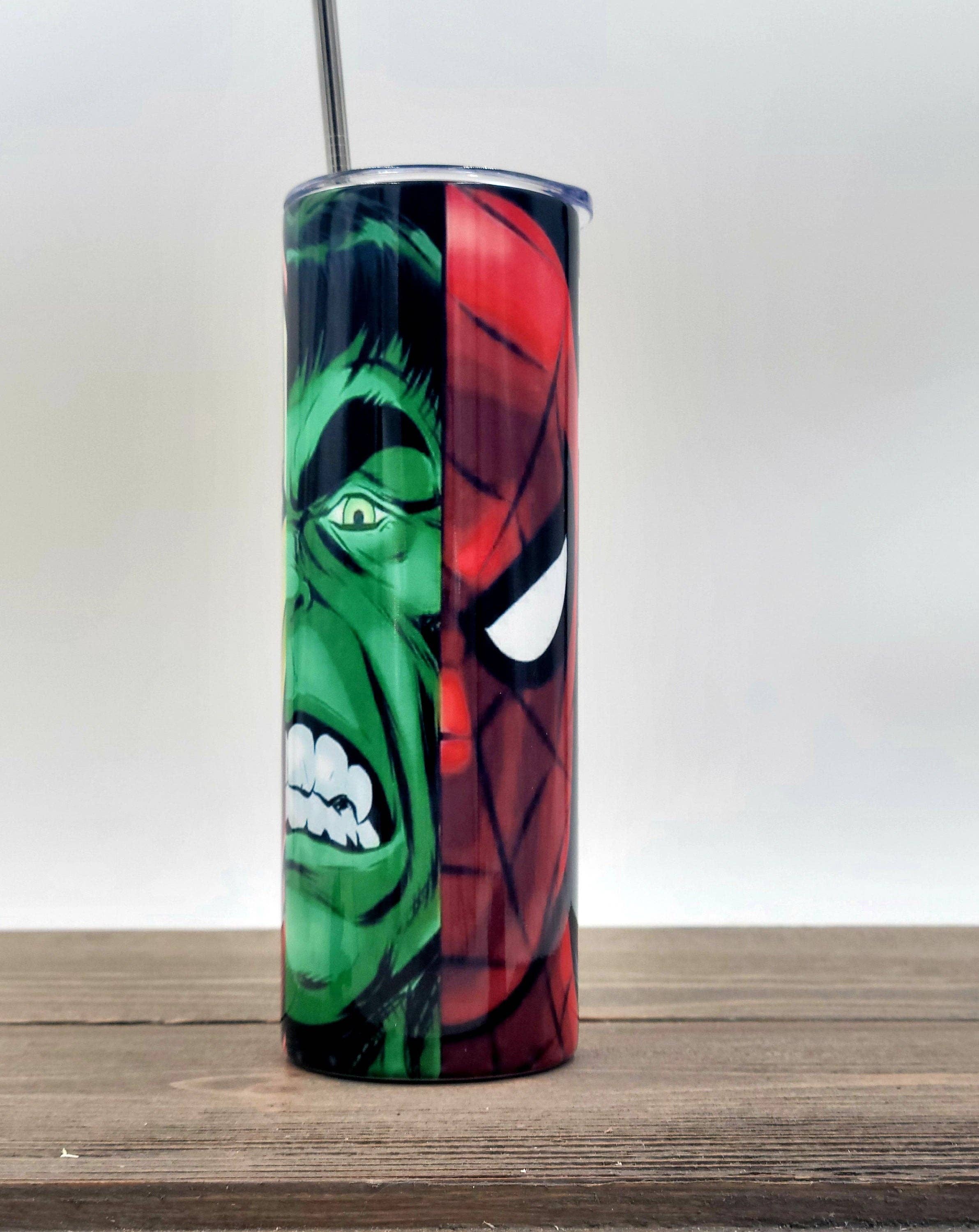 Super Hero Mash Up 20oz stainless steel tumbler with vibrant superhero design, insulated for hot and cold drinks.