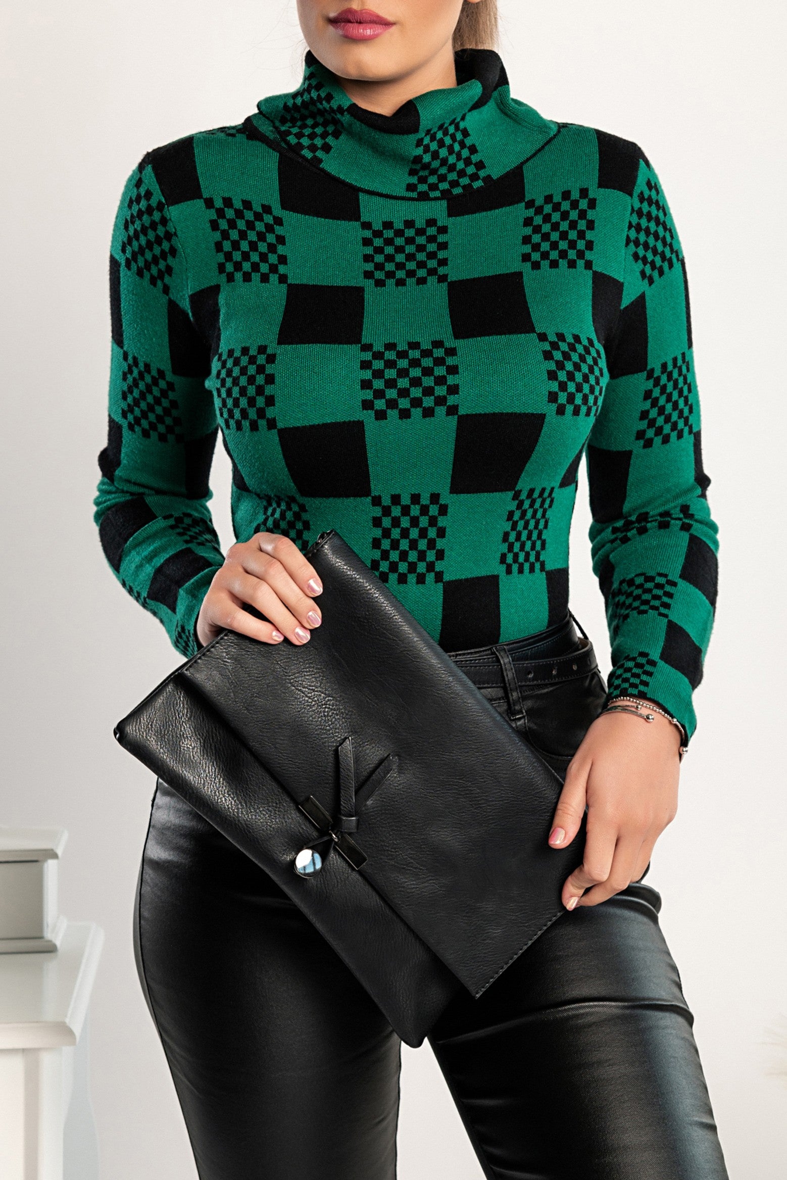 Green sweater with check print featuring long sleeves and a folded neck, showcasing a stylish and comfortable design.