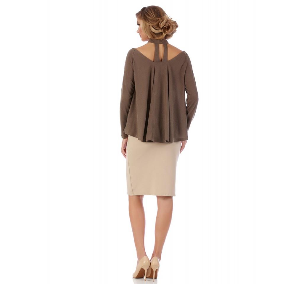 Soft and silky sweater featuring a V-neckline and mock choker, designed with long sleeves and a flared hem for comfort and style.