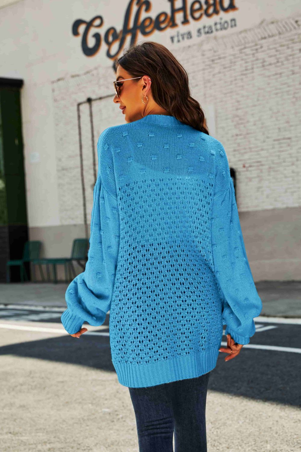 A stylish Swiss Dot Openwork Button Front Longline Cardigan in a studio setting, showcasing its unique openwork design and casual elegance.