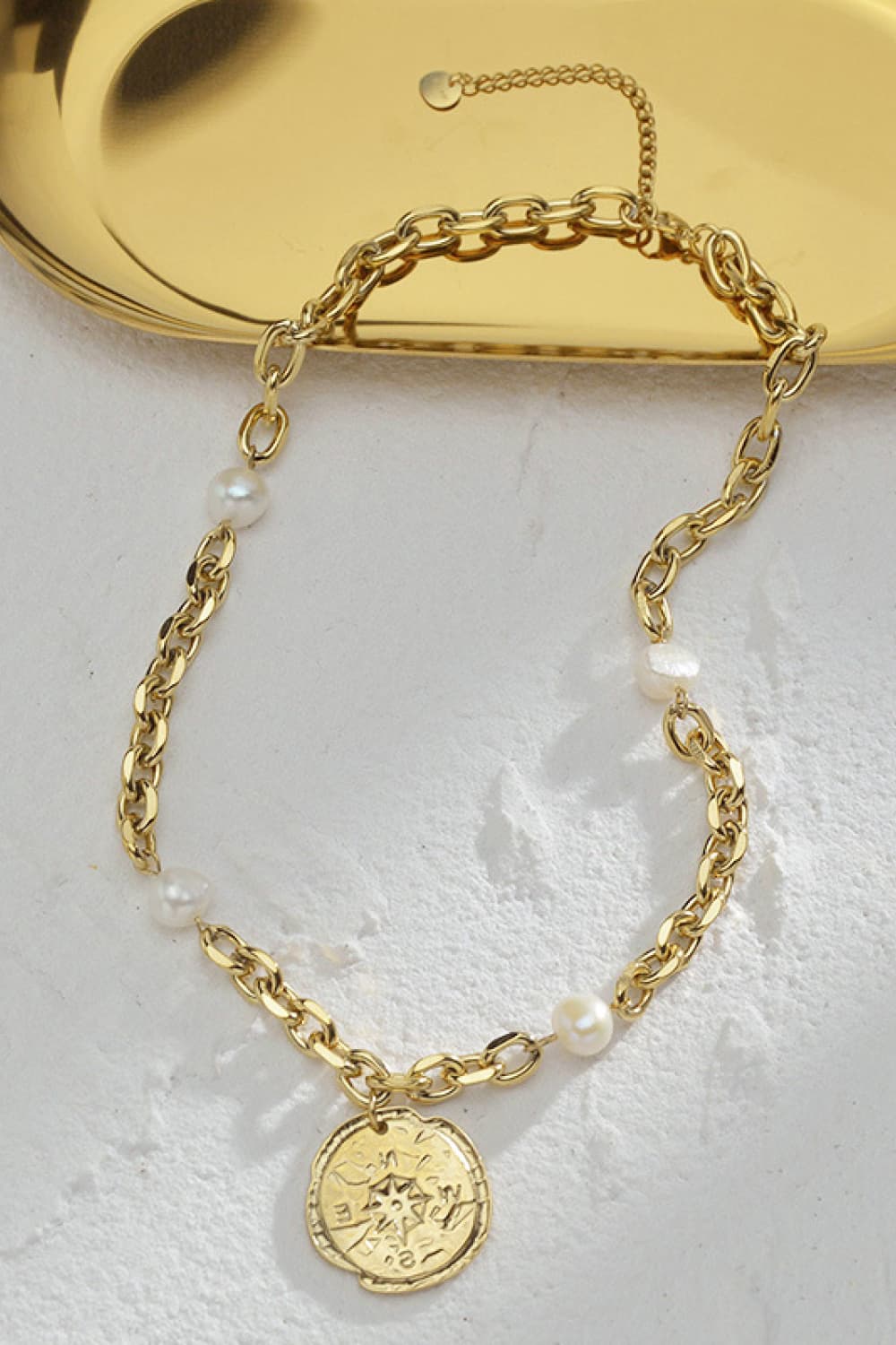 Tag Pendant Pearl Stainless Steel Necklace featuring a modern design with a pearl pendant on a stainless steel chain.