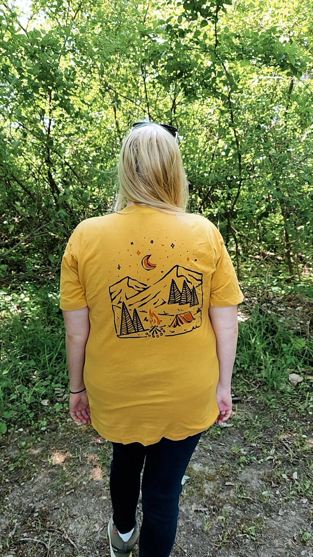 A stylish Take A Hike Tee made of 100% cotton, featuring a vibrant outdoor-themed print, perfect for camping and hiking.