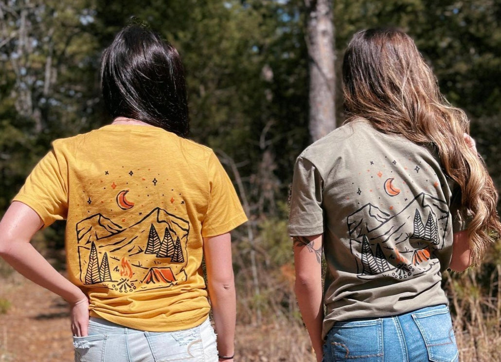A stylish Take A Hike Tee made of 100% cotton, featuring a vibrant outdoor-themed print, perfect for camping and hiking.